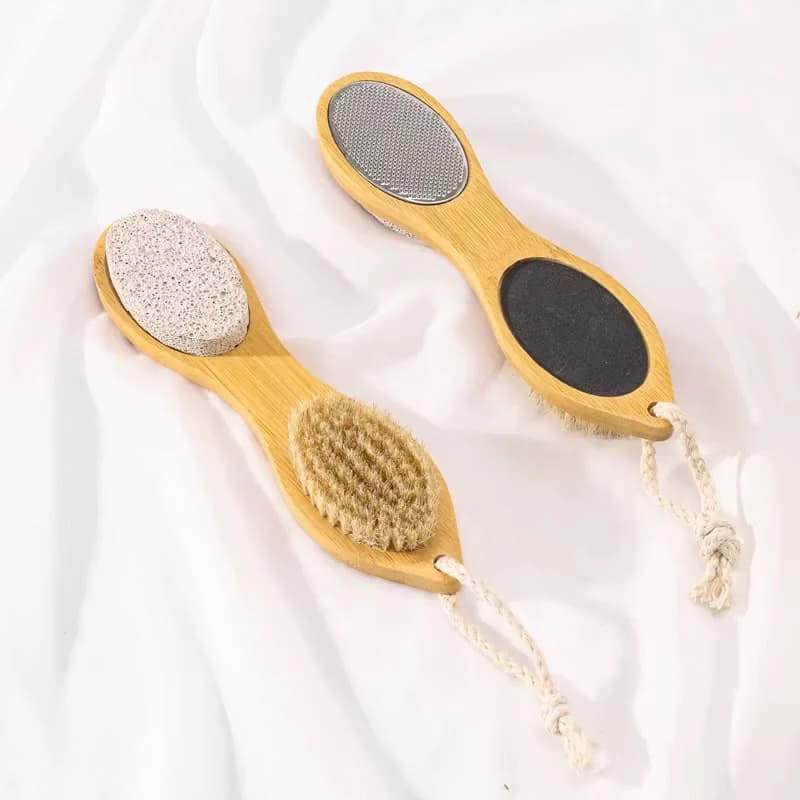 Bamboo four-in-one pedicure paddle with pumice stone, boar bristle brush, metal file and emery pad